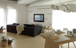 开放式空间的一角，可以看到餐厅和客厅起居区，灰色大沙发来自Moroso。