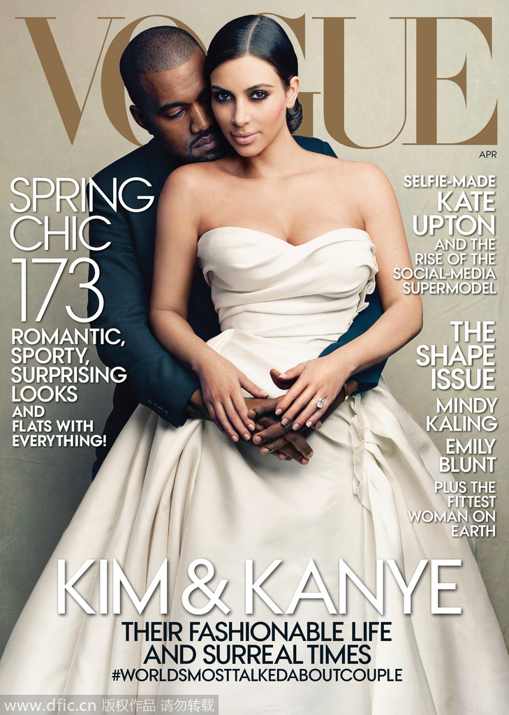 当地时间2014年3月21日，金-卡黛珊穿婚纱与未婚夫坎耶-韦斯特登上《Vogue》封面。